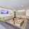 room with couches and a tv