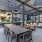 large patio with covered seating and grills