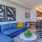 Pet-Friendly Apartments in Oakland, CA - Caspian - Furnished Living Room with Wood-Style Flooring, an Office Space, and a Kitchen