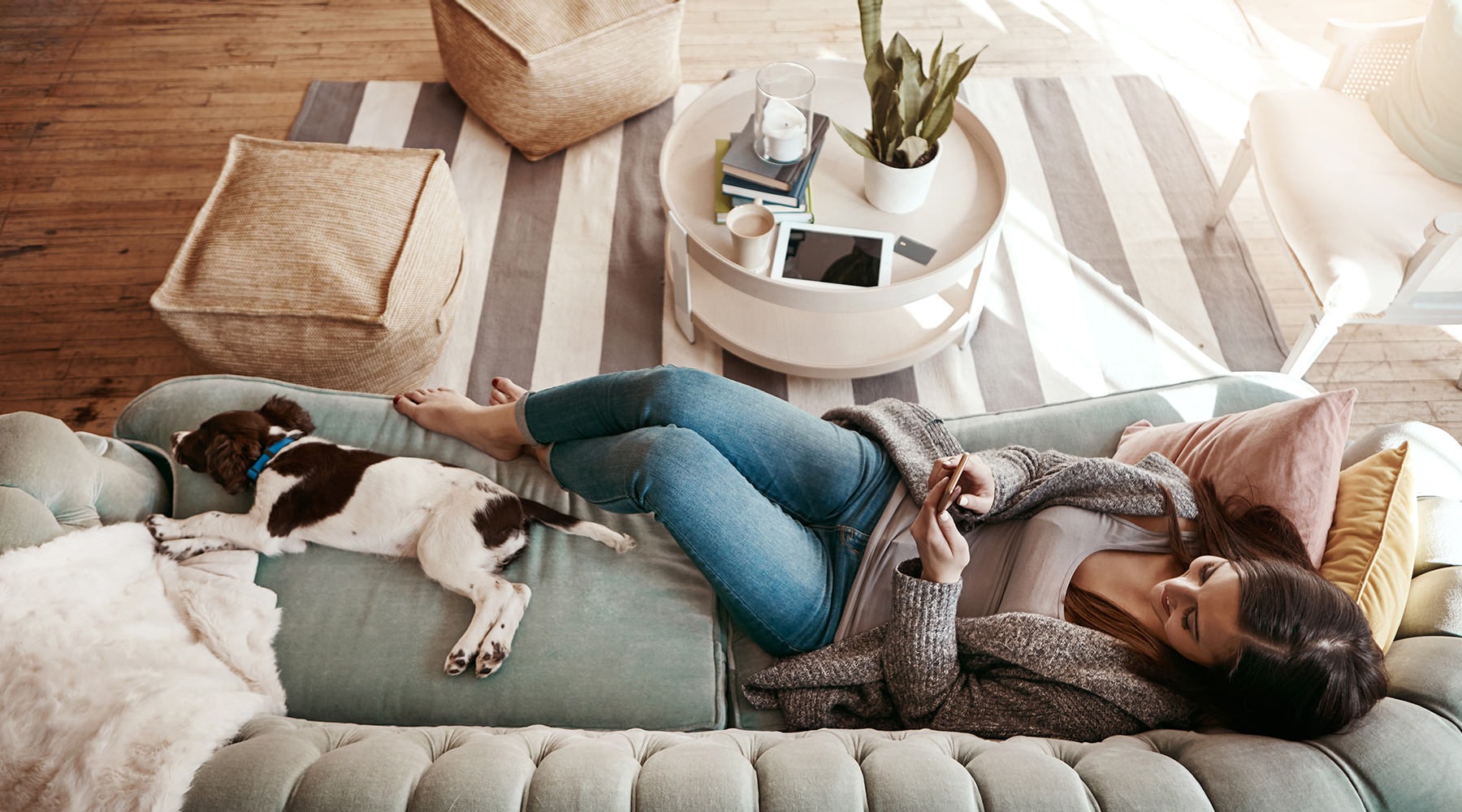 woman on a sofa with her dog