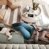 woman on a sofa with her dog